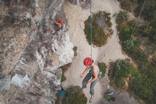 a rock climber rapelling