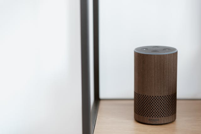 a smart home device set up on a wooden shelf